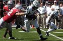 Bates tries to break a tackle